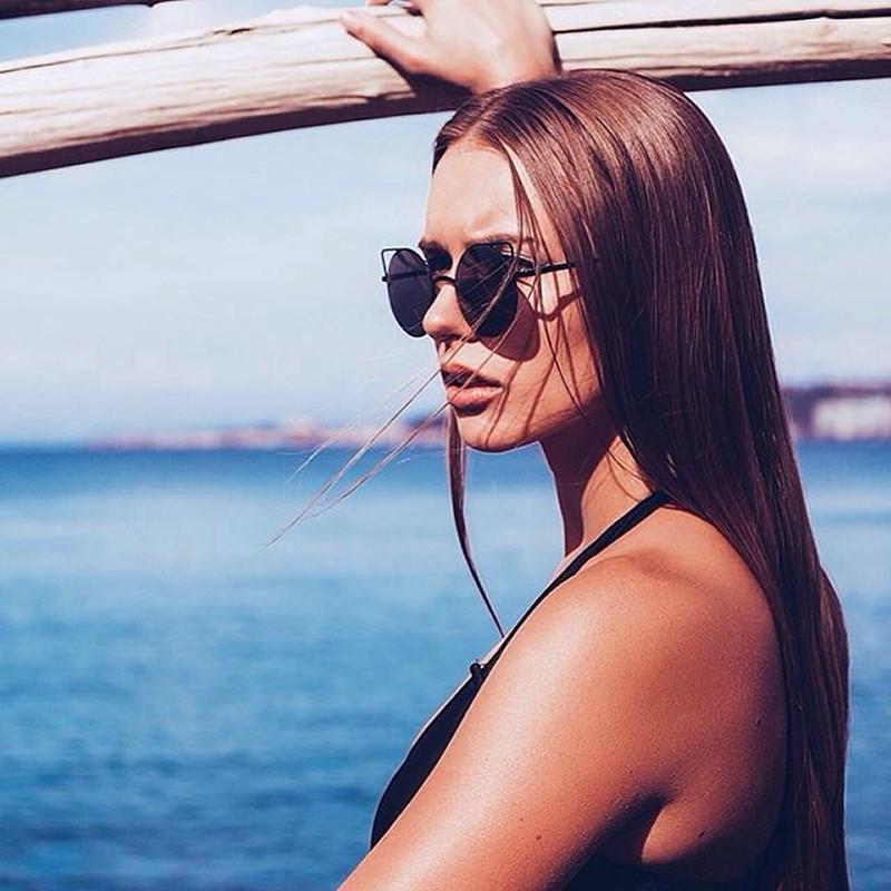 Women's Thin Laser Cut Metal Circle Cat Eye Sunglasses